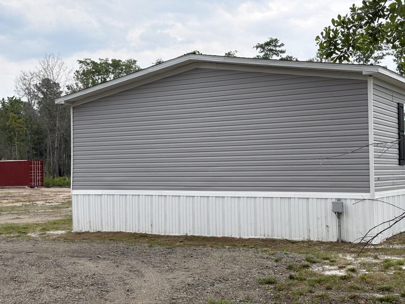 Exterior details and patio area of a home in , Cottageville (Image 24).