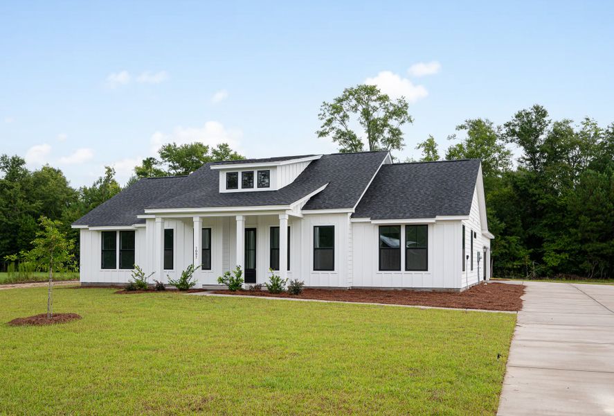 Representative exterior photo of a completed home built from the Fischer by Hunter Quinn Homes in Beaufort County Homes, Beaufort, SC (Image 22). Representative exterior photo of a completed home built from the Fischer by Hunter Quinn Homes in Beaufort County Homes, Beaufort, SC (Image 22).