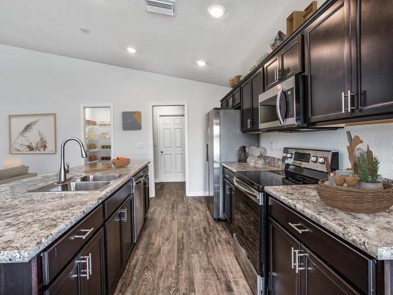 The kitchen includes ample counter space - Parsyn home plan by Highland Homes