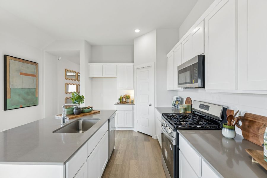 Kitchen in a Nicholson Ranch Magnolia Model Home in Lavon TX by Trophy Signature Homes