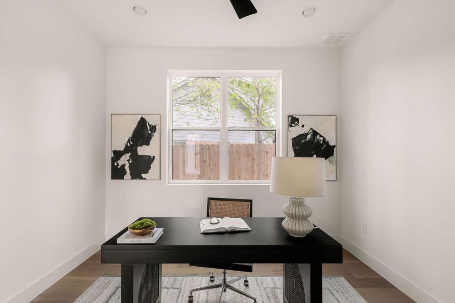 Home office with wood finished floors and recessed lighting Home office with wood finished floors and recessed lighting
