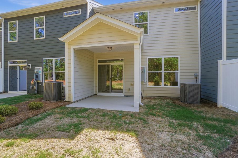 Exterior details and patio area of a home in Blythe Mill Townhomes, Waxhaw (Image 18).