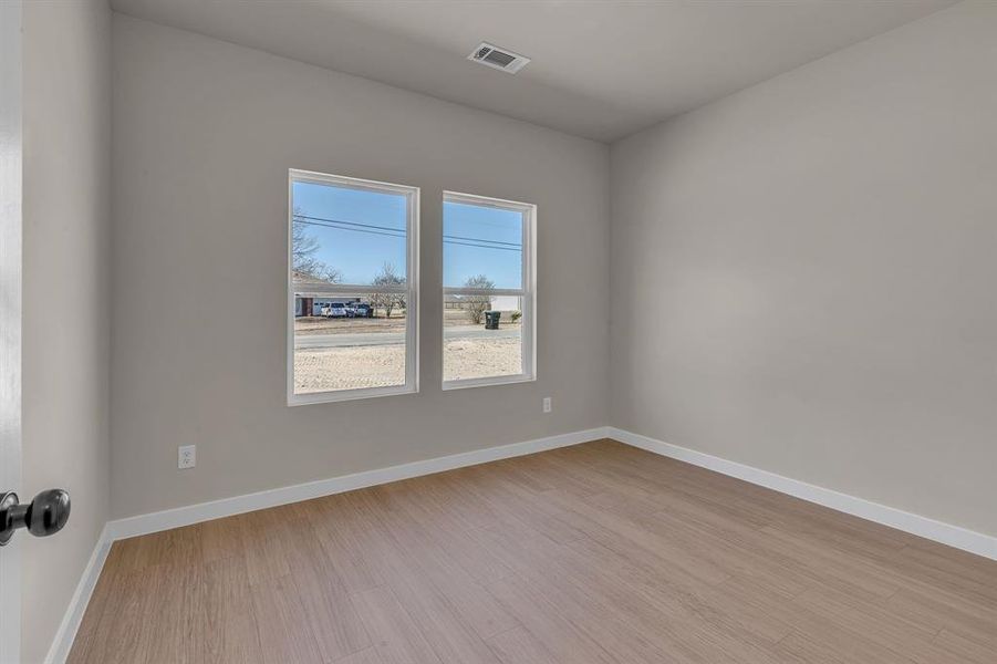 Spare room featuring light hardwood / wood-style flooring