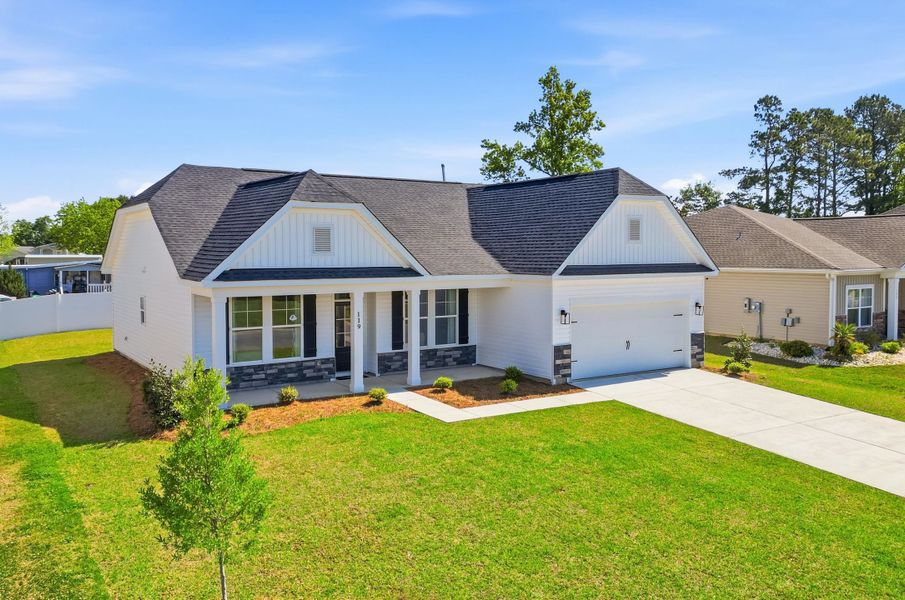 Front exterior of a new home in Oak Hollow, Longs, SC, highlighting curb appeal (Image 2). Front exterior of a new home in Oak Hollow, Longs, SC, highlighting curb appeal (Image 2).