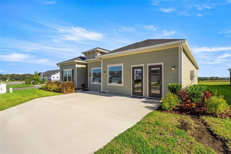 Exterior details and patio area of a home in Trailhead Landing: Trailhead Landing 60s, Alachua (Image 3).