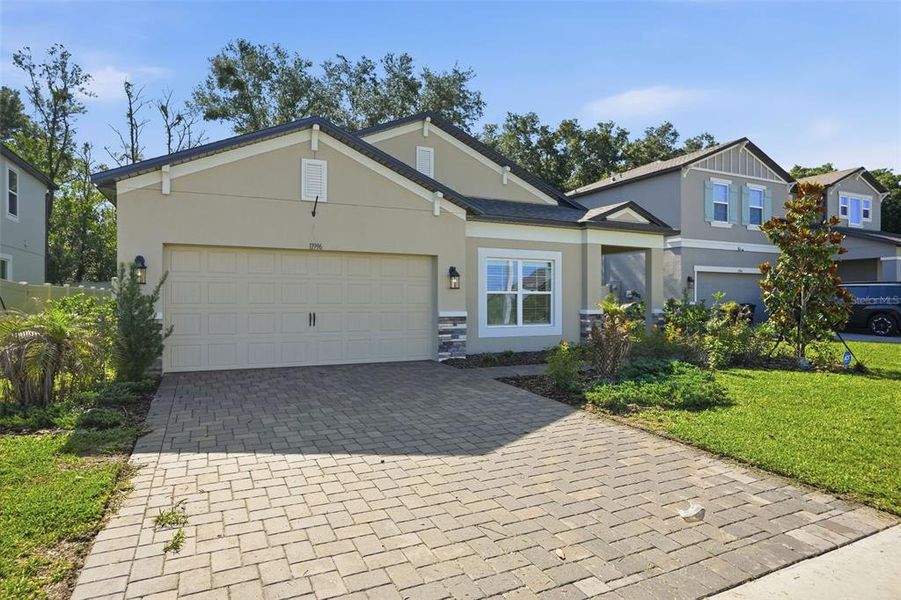 Front exterior of a new home in Hilltop Point, Dade City, FL, highlighting curb appeal (Image 2). Front exterior of a new home in Hilltop Point, Dade City, FL, highlighting curb appeal (Image 2).