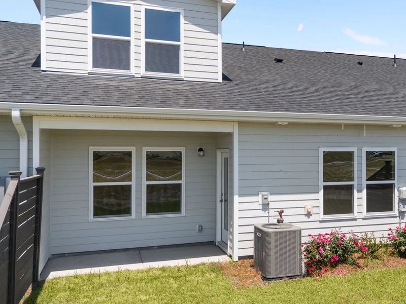 Exterior details and patio area of a home in Blue Heron Retreat, Little River (Image 3).