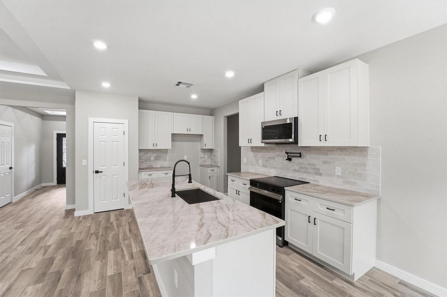 Furnished interior view inside a new home in , Conroe (Image 9).