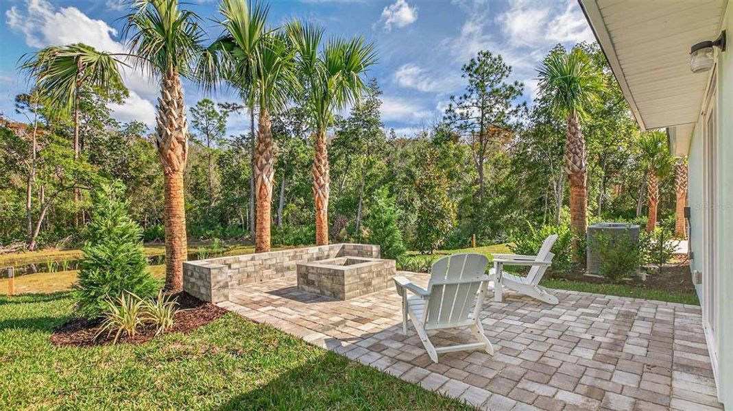 Exterior details and patio area of a home in Grand Reserve, Bunnell (Image 2).