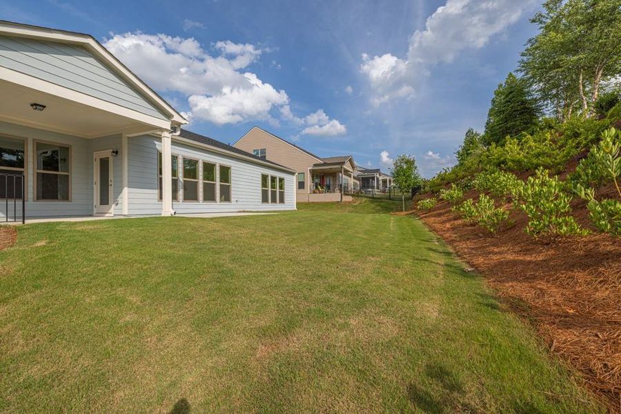 Front exterior of a new home in Del Webb Chateau Elan, Hoschton, GA, highlighting curb appeal (Image 14).
