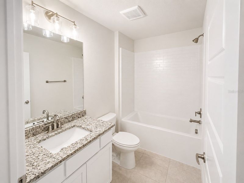 Furnished interior view inside a new home in Harmony Central, St. Cloud (Image 7).