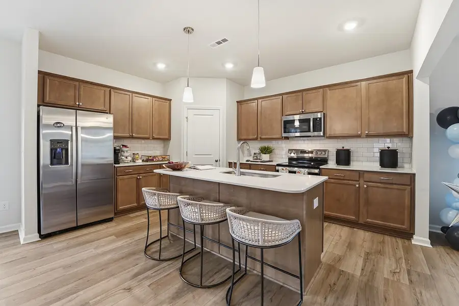 Representative furnished interior of a home built from the Telfair - Genesis Value Collection by Mungo Homes in Piper Creek, Newton (Image 3).