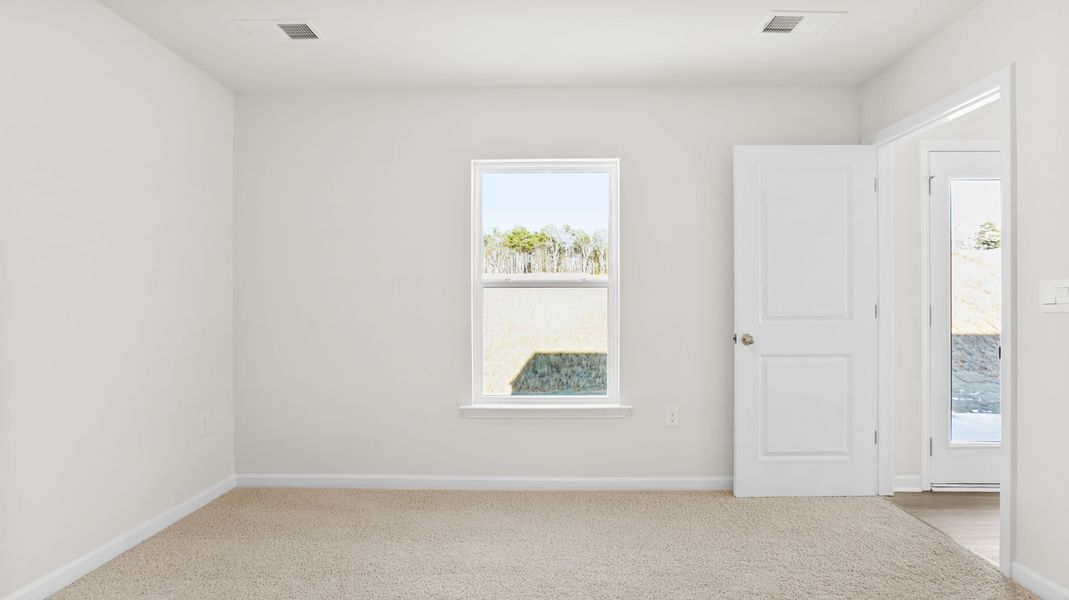 Spacious, unfurnished interior of a new home in Village Grove, Greenville (Image 24).