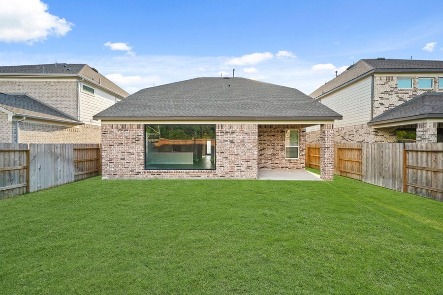 Front exterior of a new home in Sunterra North, Katy, TX, highlighting curb appeal (Image 17). Front exterior of a new home in Sunterra North, Katy, TX, highlighting curb appeal (Image 17).