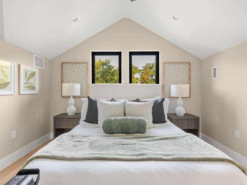 Bedroom featuring recessed lighting and vaulted ceiling
