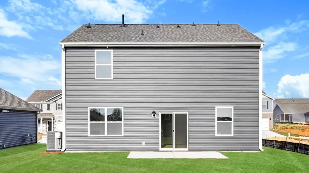 Exterior details and patio area of a home in Durbin Meadows Traditions, Fountain Inn (Image 3).