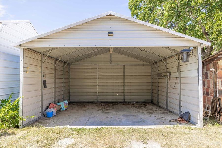 View of outdoor structure featuring a detached carport View of outdoor structure featuring a detached carport