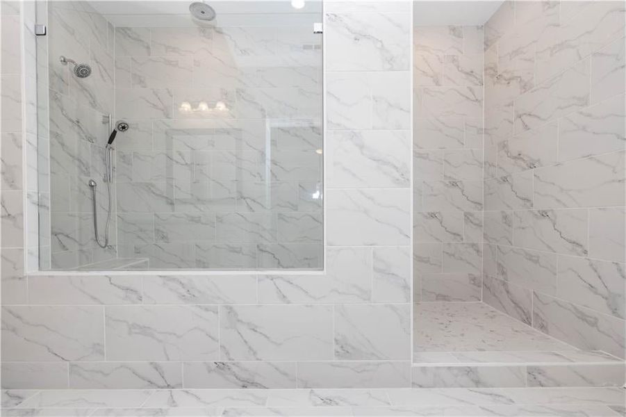 primary bathroom - walk in shower with drying area in the back - gorgeous and very luxurious - Pictures represent a previously built home