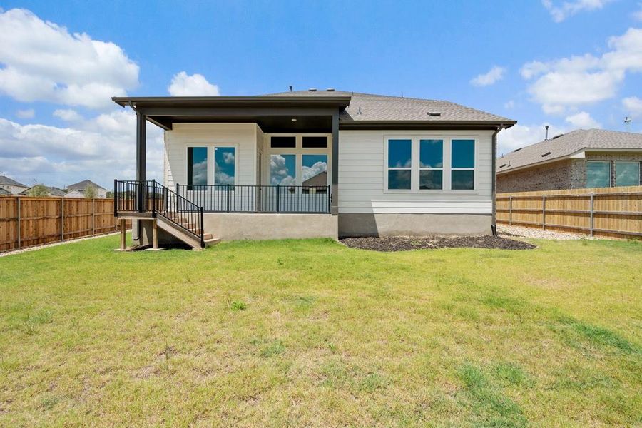 Front exterior of a new home in Park Collection at Heritage, Dripping Springs, TX, highlighting curb appeal (Image 23). Front exterior of a new home in Park Collection at Heritage, Dripping Springs, TX, highlighting curb appeal (Image 23).