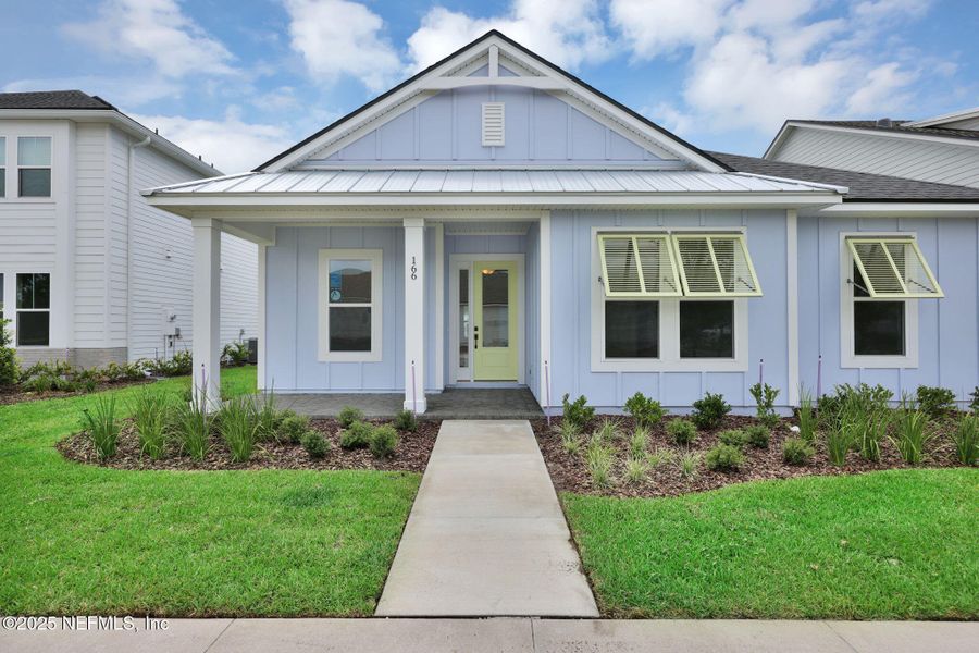 Front exterior of a new home in Seabrook Village at Seabrook, Nocatee, FL, highlighting curb appeal (Image 21).