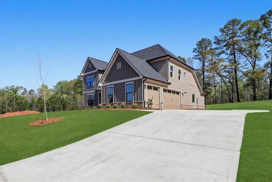 Front exterior of a new home in , Hoschton, GA, highlighting curb appeal (Image 29).