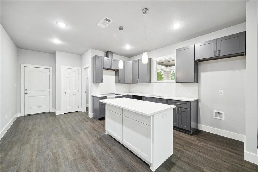 Large kitchen island in kitchen with tons of cabinetry