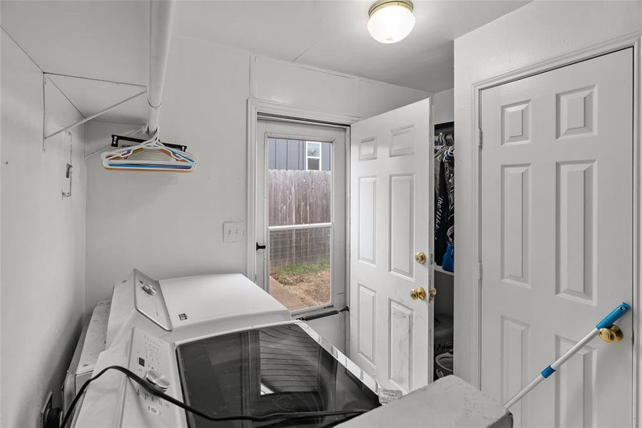 Laundry area with washer and clothes dryer