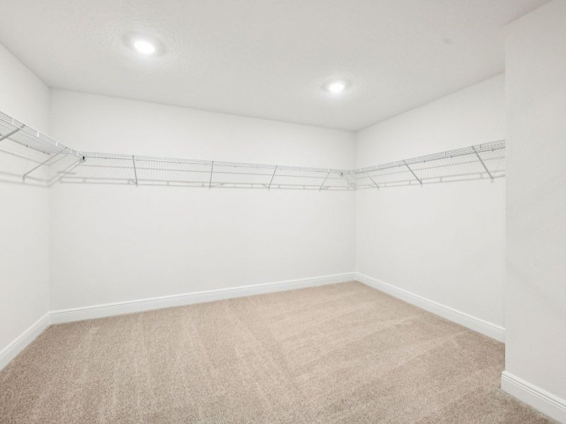 Spacious, unfurnished interior of a new home in The Reserve at Hammock Oaks - Signature Series, Lady Lake (Image 13).