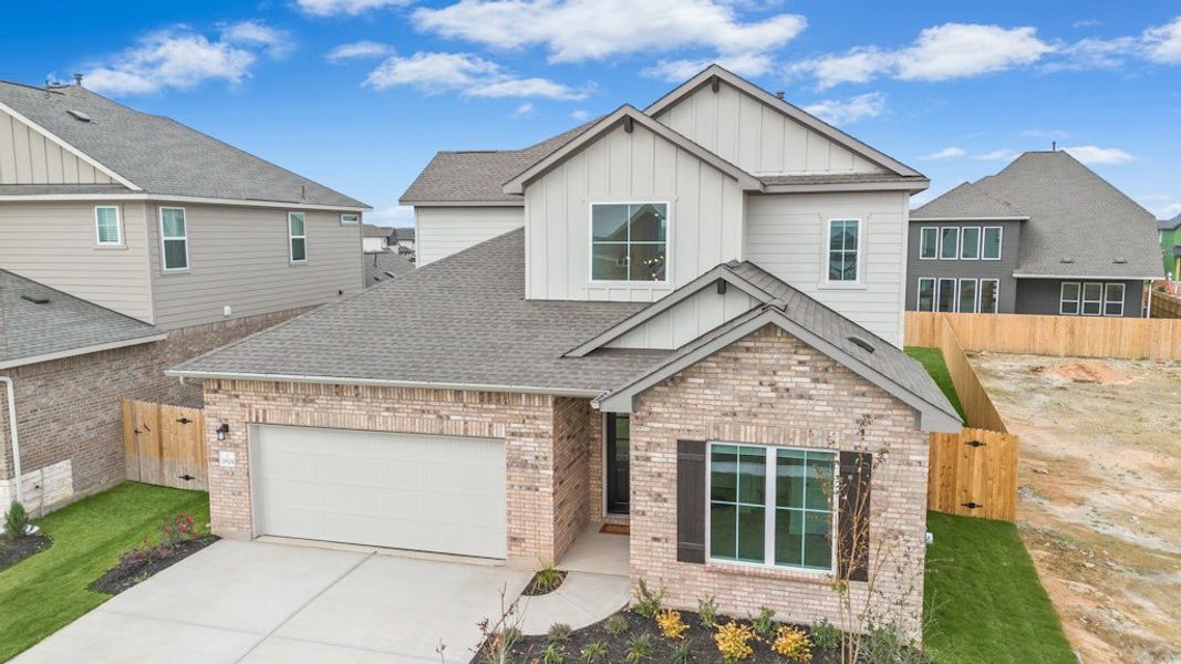 Front exterior of a new home in Blackhawk, Pflugerville, TX, highlighting curb appeal (Image 19).