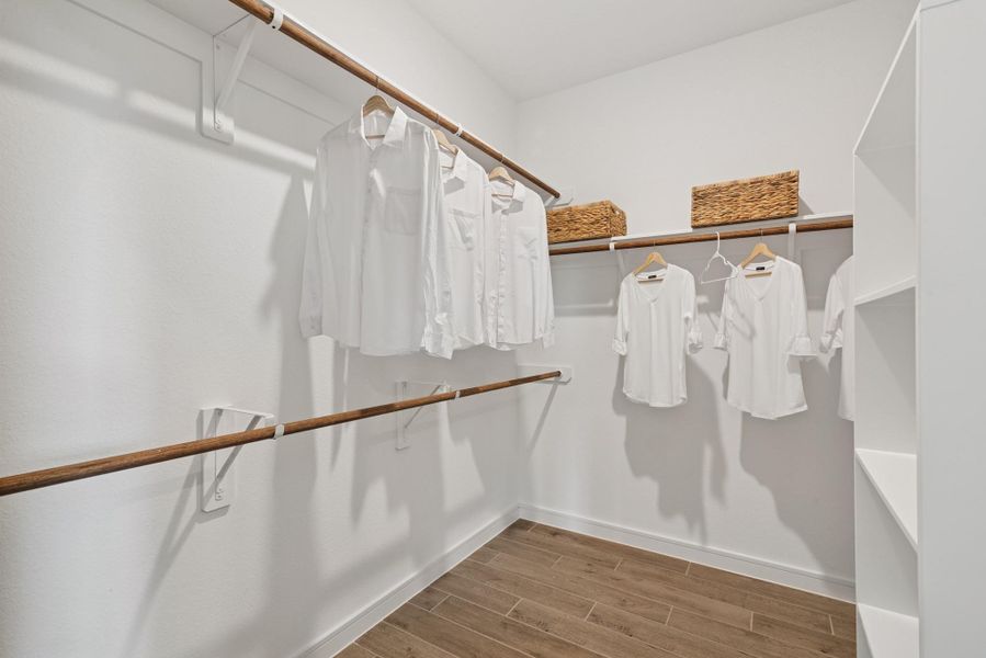 Walk-in closet in the primary suite (*Photo not of actual home and used for illustration purposes only.) Walk-in closet in the primary suite (*Photo not of actual home and used for illustration purposes only.)