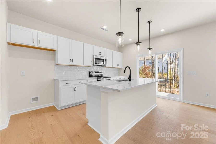 Crisp White Cabinetry Contrasting with Matte Black Hardware.