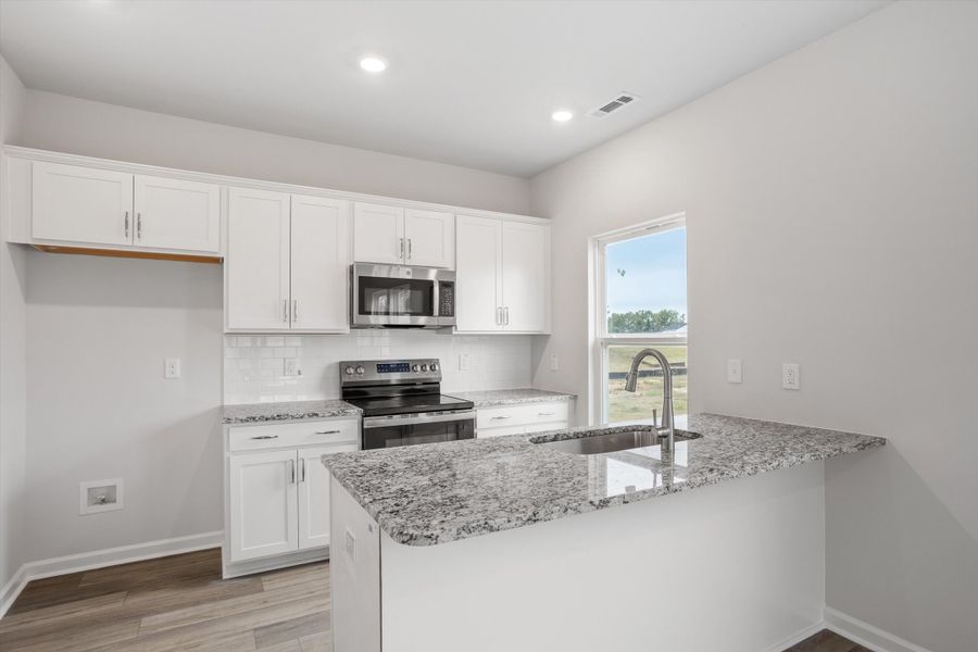 Furnished interior view inside a new home in Cambridge Reserve, Angier (Image 7).