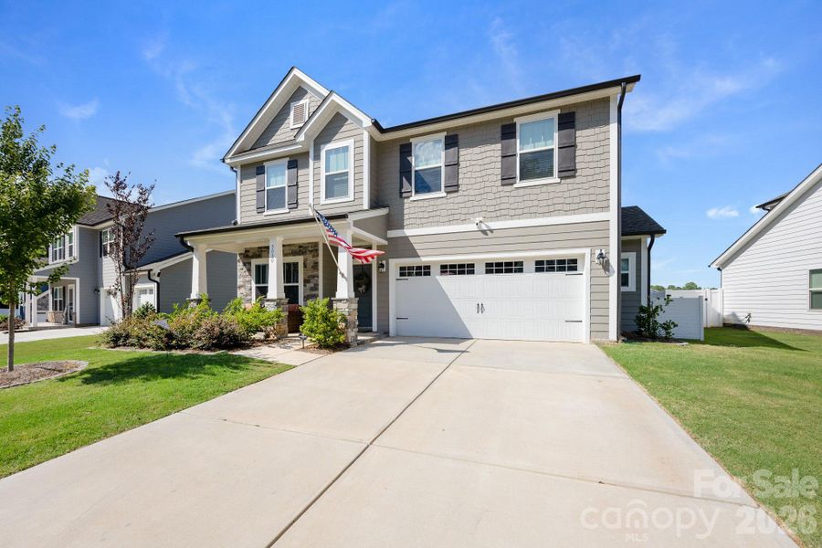 Front exterior of a new home in , Mount Holly, NC, highlighting curb appeal (Image 24).