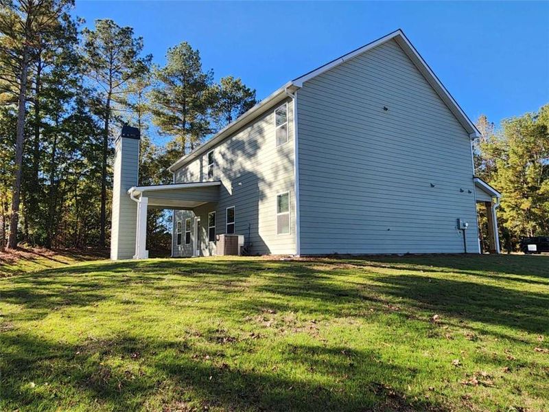 Exterior details and patio area of a home in The Woodlands Preserve, Jackson (Image 3).