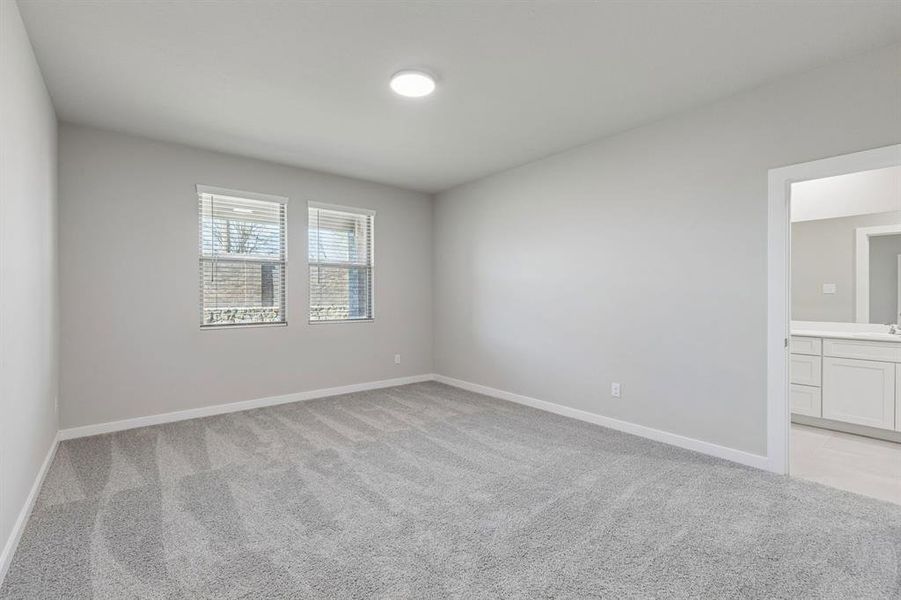 Primary Suite in the Holden home plan by Trophy Signature Homes – REPRESENTATIVE PHOTO