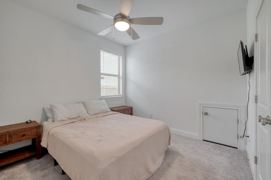 Set apart from the other upstairs bedrooms, this secondary room offers a little extra privacy.