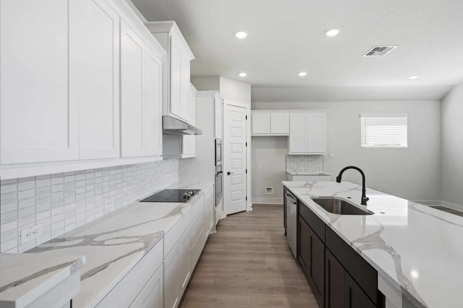 Representative furnished interior of a home built from the Mackenzie by Chesmar Homes in Sienna Lakes, San Antonio (Image 5).