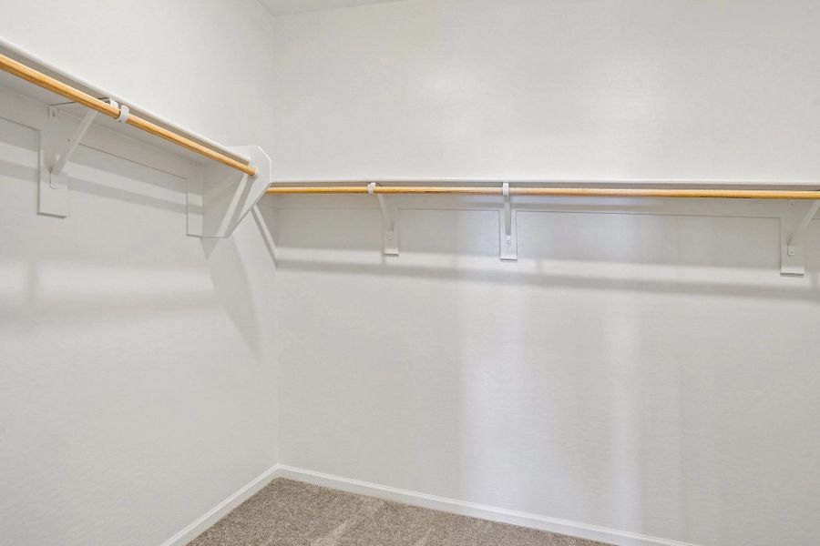 Primary walk in closet Primary walk in closet