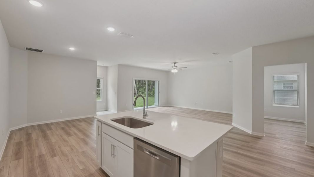 Experience luxury with quartz countertops and elegant vinyl plank flooring in Palm Coast's prestigious address.