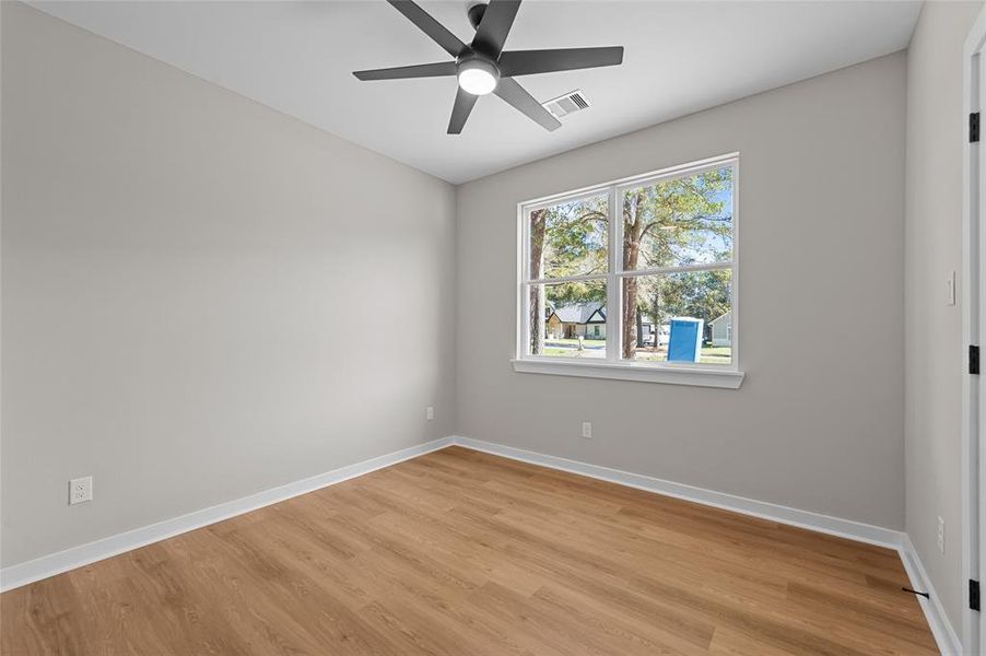 1st bedroom located at the front of the home. This room faces the front year/street.