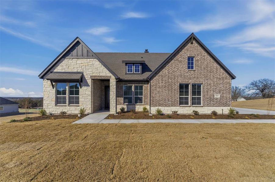 Front exterior of a new home in Oak Grove Addition, Springtown, TX, highlighting curb appeal (Image 21).