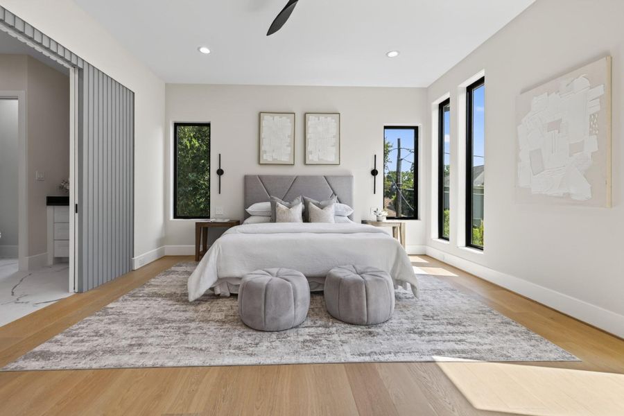 Spacious secondary bedroom with hardwood floors and generous natural light.