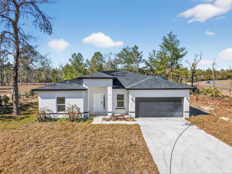 Front exterior of a new home in , Ocklawaha, FL, highlighting curb appeal (Image 2). Front exterior of a new home in , Ocklawaha, FL, highlighting curb appeal (Image 2).