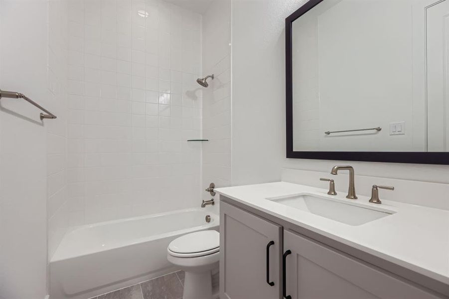 Full bath featuring vanity and shower / tub combination