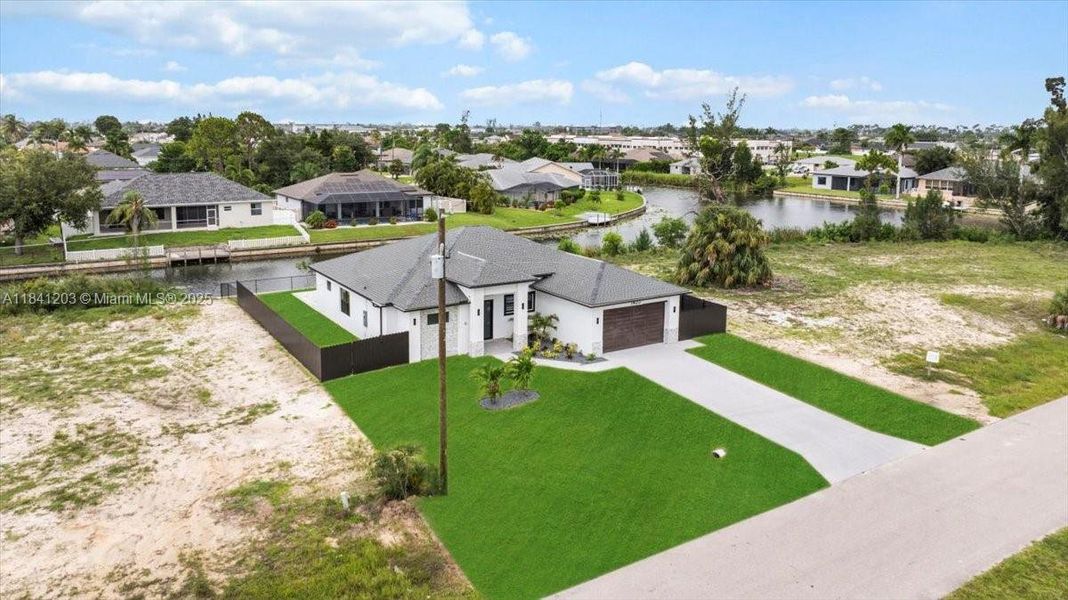 Front exterior of a new home in , Cape Coral, FL, highlighting curb appeal (Image 27). Front exterior of a new home in , Cape Coral, FL, highlighting curb appeal (Image 27).