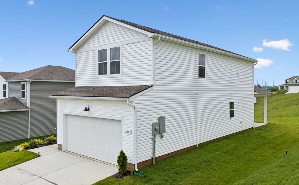Front exterior of a new home in Highlands of Carter's Station, Columbia, TN, highlighting curb appeal (Image 18). Front exterior of a new home in Highlands of Carter's Station, Columbia, TN, highlighting curb appeal (Image 18).