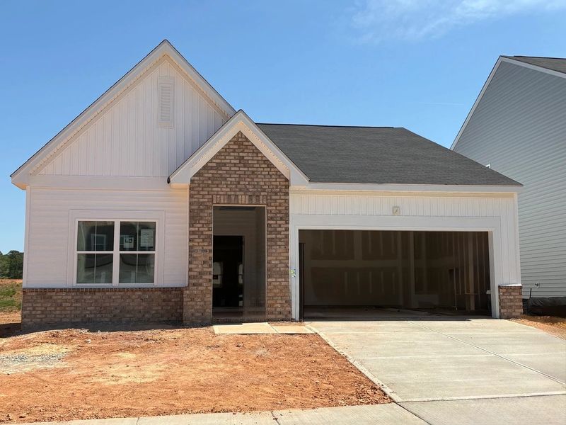 Front exterior of a new home in Crescent Mills, Wilson's Mills, NC, highlighting curb appeal (Image 1). Front exterior of a new home in Crescent Mills, Wilson's Mills, NC, highlighting curb appeal (Image 1).