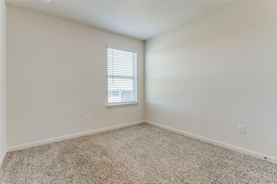 Spare room featuring carpet floors