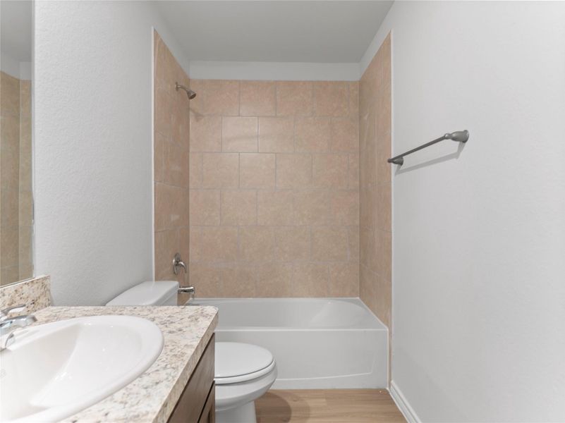 Elegant upstairs full bathroom with modern fixtures and a sleek design. Elegant upstairs full bathroom with modern fixtures and a sleek design.