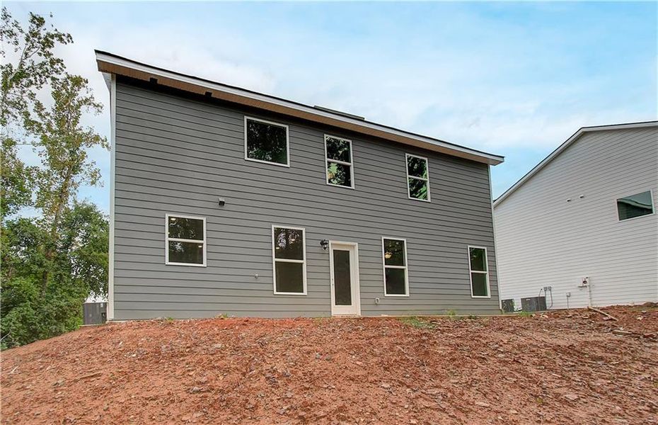 Exterior details and patio area of a home in Berkeley Lakes, Locust Grove (Image 4).